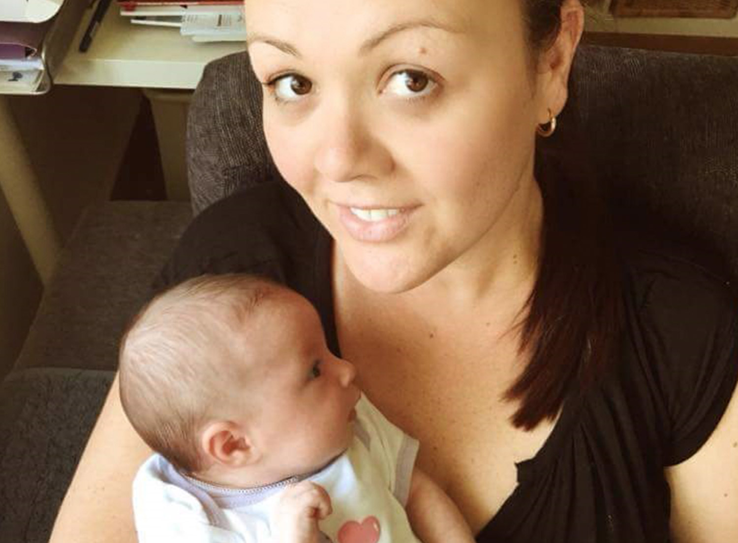 KinCare Home Care Worker Abby holding a baby